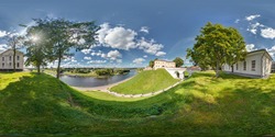 Full 360 by 180 degrees seamless view panorama in equirectangular equidistant spherical projection on the ruins of an ancient medieval castle over the river neman in sunny day. Skybox for VR content