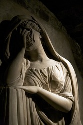 white marble classic statue of a woman crying