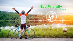 Eco Friendly concept, Green energy, carbon dioxide reduction and pollution reduction. Car free day concept to save the world and Save the earth. A man ride bicycle in midst of nature.