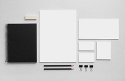 Mockup business brand template on gray background. Set of stationery with a black notepad.