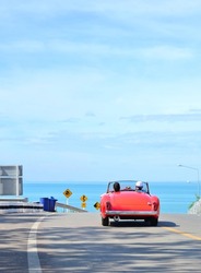 couple in red car on Valentine's Day