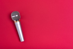 Concert microphone on a beautiful red background.