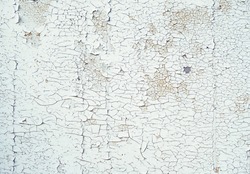 grunge old cracked plaster textured wall background. dirty white color painted wall close up. Template for design. 