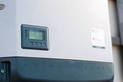 Solar inverter on the side of a house	
