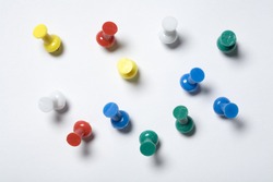 Colorful thumb tacks on a white background