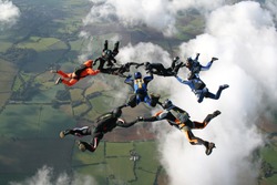 Nine skydivers in freefall