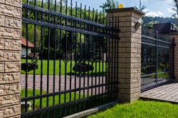 
A modern metal fence around the house