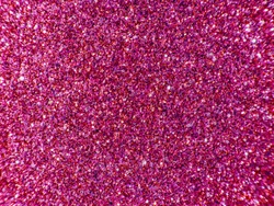 Background sequin. PINK sparkle background. Holiday abstract glitter background with blinking lights. Fabric sequins in bright colors. Fashion fabric glitter, sequins.