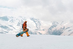 snowboarder in the Caucasus mountains in winter, snow ,Russia
