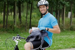 happy male cyclist in forest