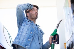 man in shock with gas price