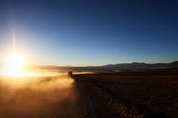 Lonely car at sunrise at Altiplano, Bolivia