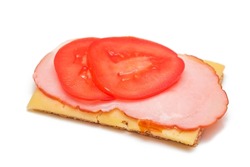 Whole Grain Crispbread with Tomato, Ham and Cheese - Isolated on White. Easy Breakfast. Quick and Healthy Sandwiches. Crispbread with Tasty Filling. Healthy Dietary Snack - Isolation