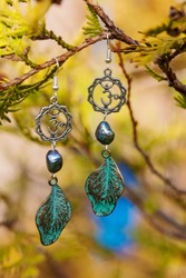 Earrings with burdock leaves and river black pearls