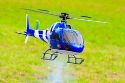Flying helicopter (radio controlled scale-model 1:24 scale) Teleobjective shot with shallow DOF.
