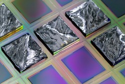 A wafer is a thin slice of semiconductor material, such as a crystalline silicon, used in electronics for the fabrication of integrated circuits.Selective focus on pieces.