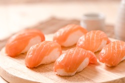 Fresh japanese salmon sushi on wood table