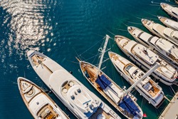 Aerial photo of luxury super yacht marina and sailing boats 