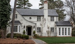 White brick house in rural suburban neighborhood. North Carolina, South Carolina, architecture