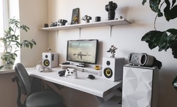 General view home workplace of gamer with computer and gamepad. 