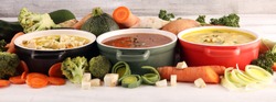 Set of three soups from worldwide cuisines, healthy food. Broth with noodles, beef soup and broth with marrow dumplings. All soups with healthy vegetables.