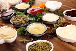 Sauces Assortment. Set of various sauces in bowls with ketchup, mayonnaise, pesto and mustard