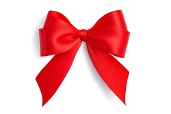 Flat lay beautiful red bright four-loop holiday gift bow made of satin ribbon with gray light soft shadow isolated on white background