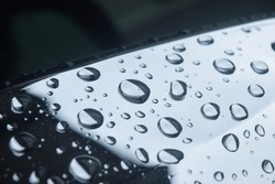 close up rain drops on the mirror car side view after raning feeling lonely