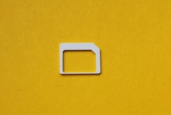 card for sim card mobile phone close-up on a yellow background