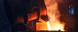Metal pouring with sparks. Smelting of cast iron parts in foundry. Metallurgical plant or Steel Mill