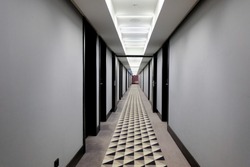 Long hotel corridor with carpet