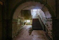 Dark and creepy corridor of old abandoned mental hospital.