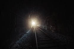 Light at the end of railroad tunnel.