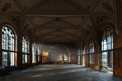 Large hall of abandoned building in gothic style.