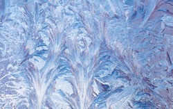 Macro of abstract frost pattern on window.