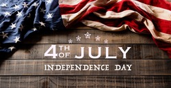 Happy Independence Day. American flags against old wooden background. July 4.