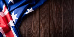 Happy Australia day concept. Australian flag against old wooden background. 26 January.