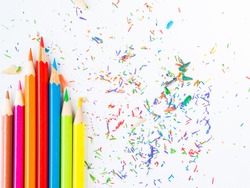 Colorful pencils with colorful pencil shavings on white background. Back to school concept.