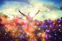 Young girl spreading hands with joy and inspiration facing the sun,sun greeting,freedom concept,bird flying above sign of freedom and liberty,heart bokeh
