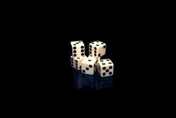 The white dice with a certain number of black dots