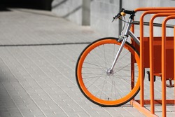 Orange bicycle stands on the orange bicycle park