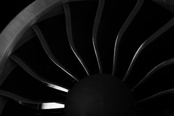 Plane background. Airplane turbine blades close-up. Airplane engine. Turbines blade. Aviation Technologies. Aircraft jet black detail during maintenance. Macro.