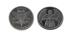 Ukrainian 10 hryvnia coin isolated. Coins of 2021. Air assault troops Ukraine. Coat of arms and symbol. Ukrainian military guardian with wings and sword on money circulation.