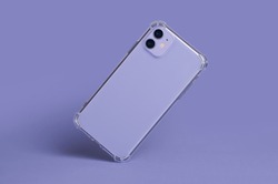 Phone case mockup isolated on purple background. iPhone 11 and 12 in clear silicone case falls down back view very peri 2022 color