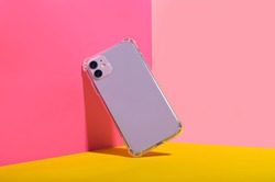 Purple iPhone 11 in clear phone case, bright and colorful phone case mock up 