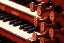 Details of pipe organ stops (knobs for changing voices) (selective focus)