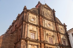 Unidentified tourists visit the famous landmark - Basilica of Bom Jesus (Borea Jezuchi Bajilika) in Old Goa, India. Basilica is a UNESCO World Heritage Site.