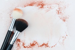 Makeup brushes on background with powder. Make-up background