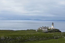landscape of Neist Point Lighthouse isle of Skye , The white lighthouse on edge of  cliff ,coastal lighthouse