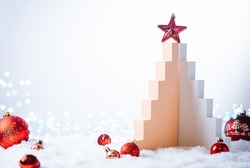 Christmas tree made of geometric shapes and podiums on white background